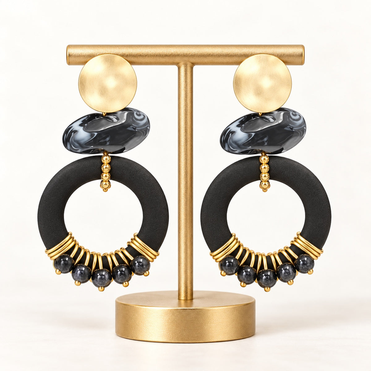 Black and gold-tone beaded statement hoop earrings