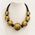 Gold brass ball necklace on bust