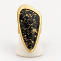 Black gold-flecked statement stretch ring with gold-tone border
