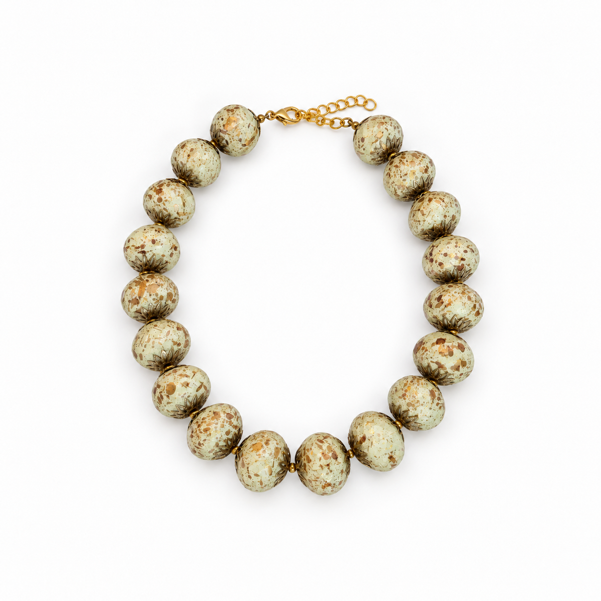 Ivory speckled beaded necklace laid flat