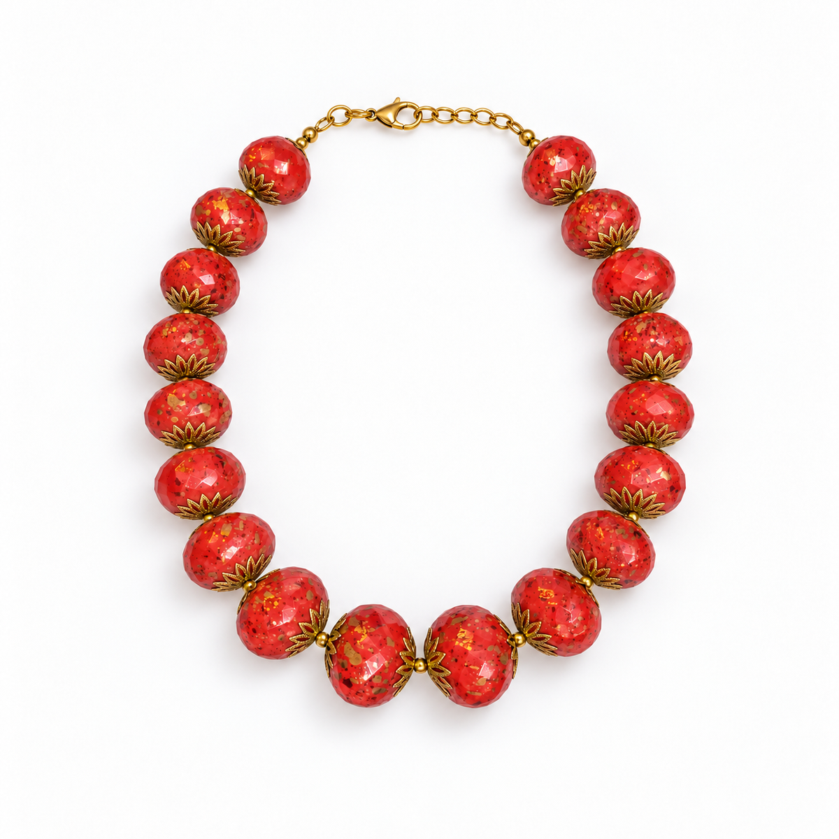 Red speckled beaded necklace laid flat