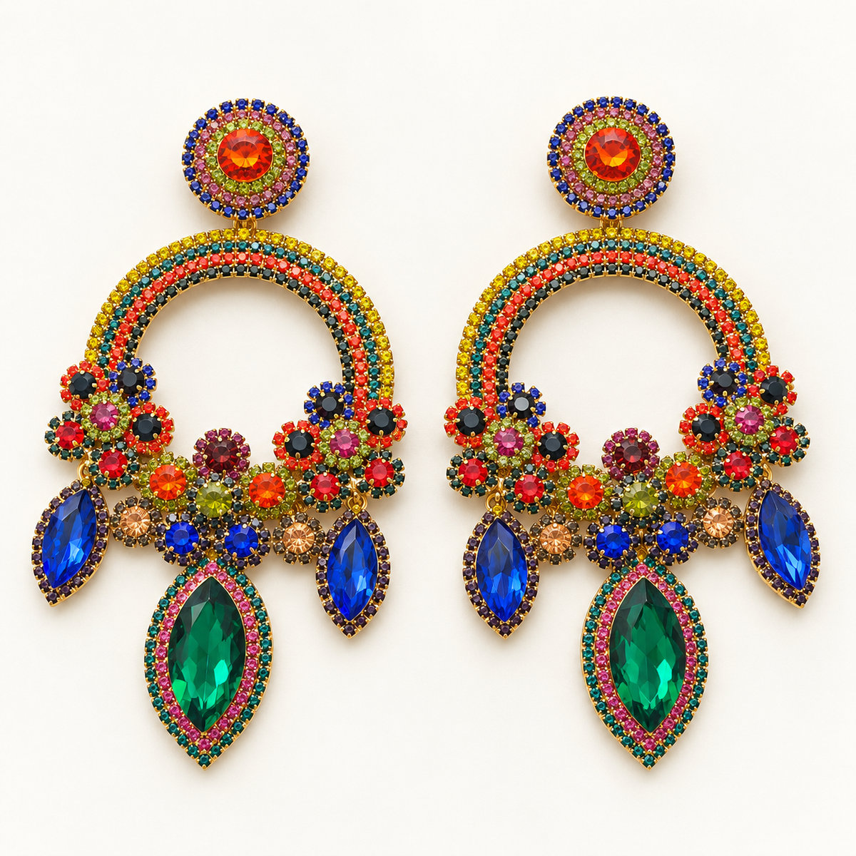Multicolor chandelier earrings lying flat on a light background