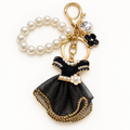 Black dress keychain and bag charm with pearl-style beads and gold-tone hardware