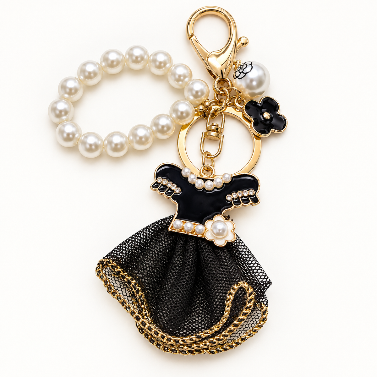 Black dress keychain and bag charm with pearl-style beads and gold-tone hardware