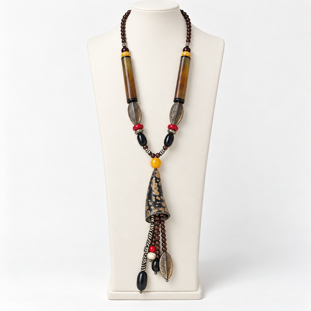 Long horn necklace with beaded dangles on an ivory display bust
