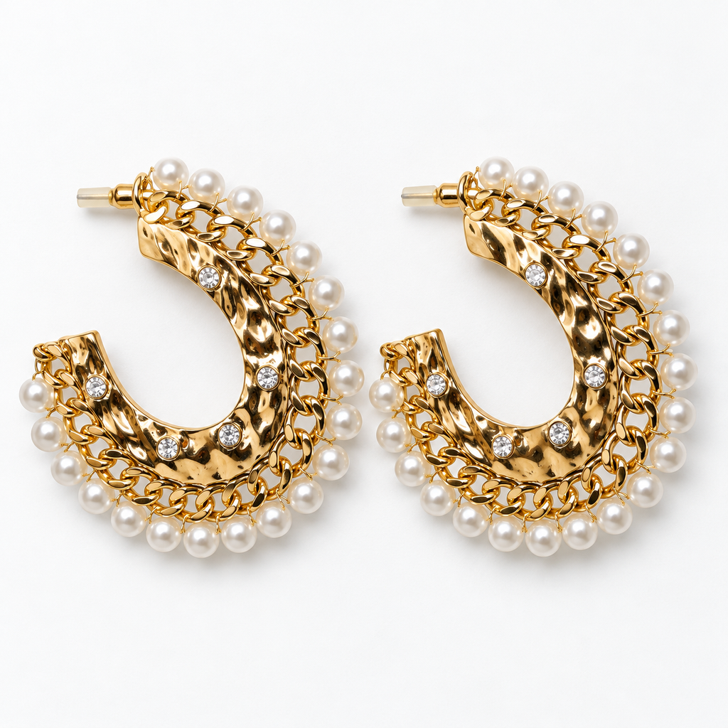 Gold-tone hammered open hoop earrings with chain detailing and white pearl-look trim lying flat
