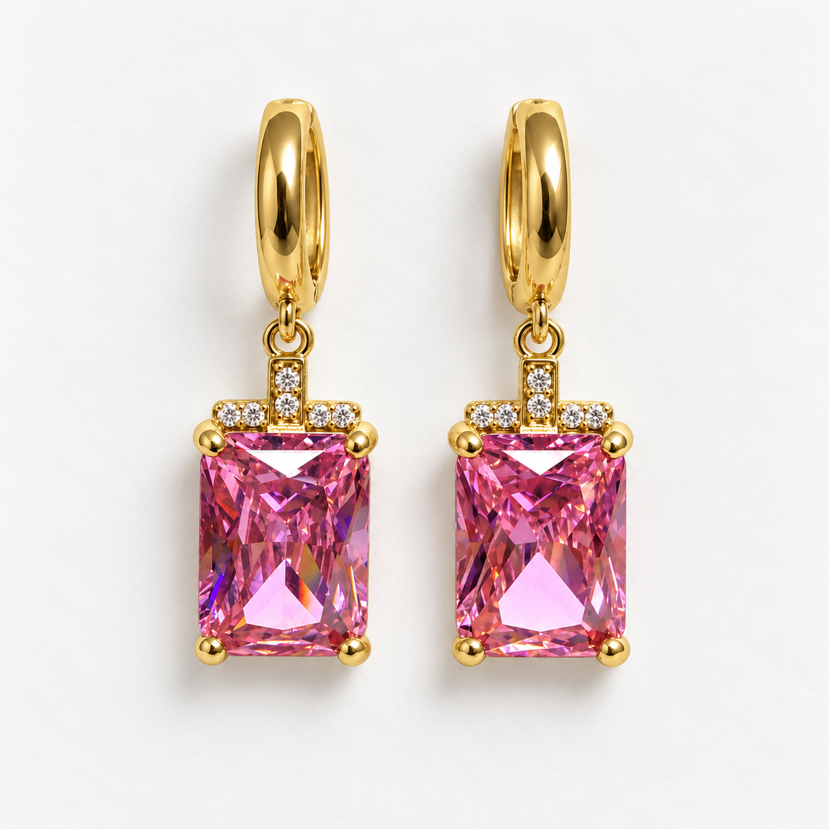 Gold and pink rectangular gemstone drop huggie earrings, flat view