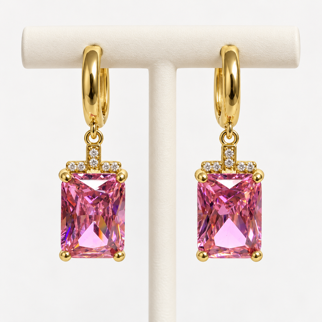 Gold and pink rectangular gemstone drop huggie earrings, on an earring holder