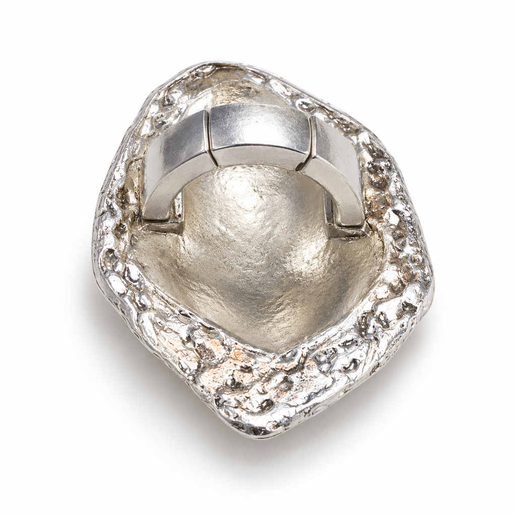 Back of the silver-tone Sculpted Metal Stretch Ring showing its segmented stretch band