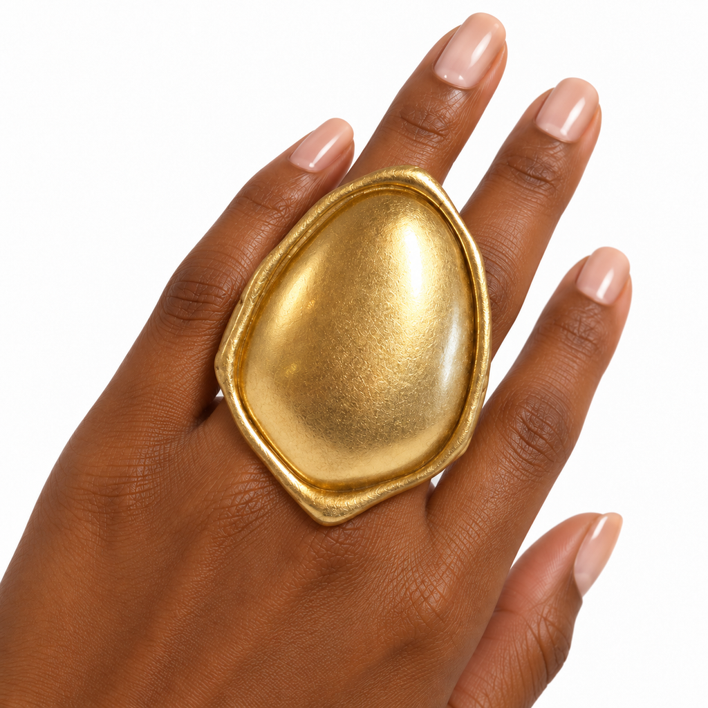 Gold-tone Sculpted Metal Stretch Ring worn on a finger
