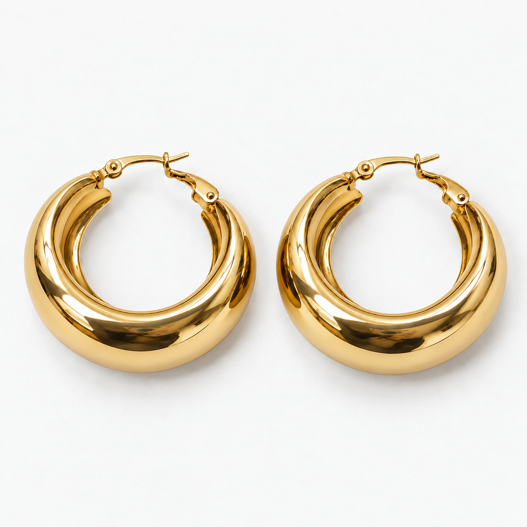 Front flat-lay view of gold-tone medium wide hoop earrings