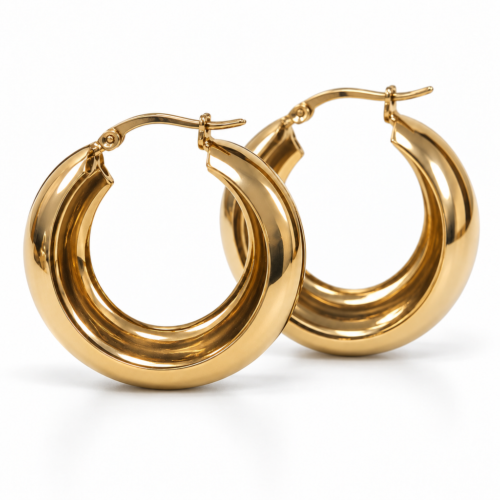 Side view of gold-tone medium wide hoop earrings