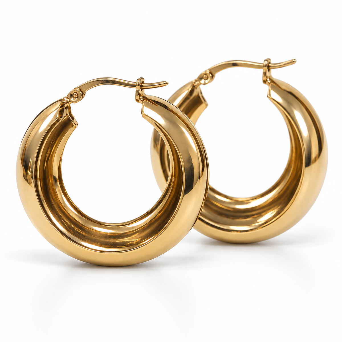 Side view of gold-tone medium wide hoop earrings