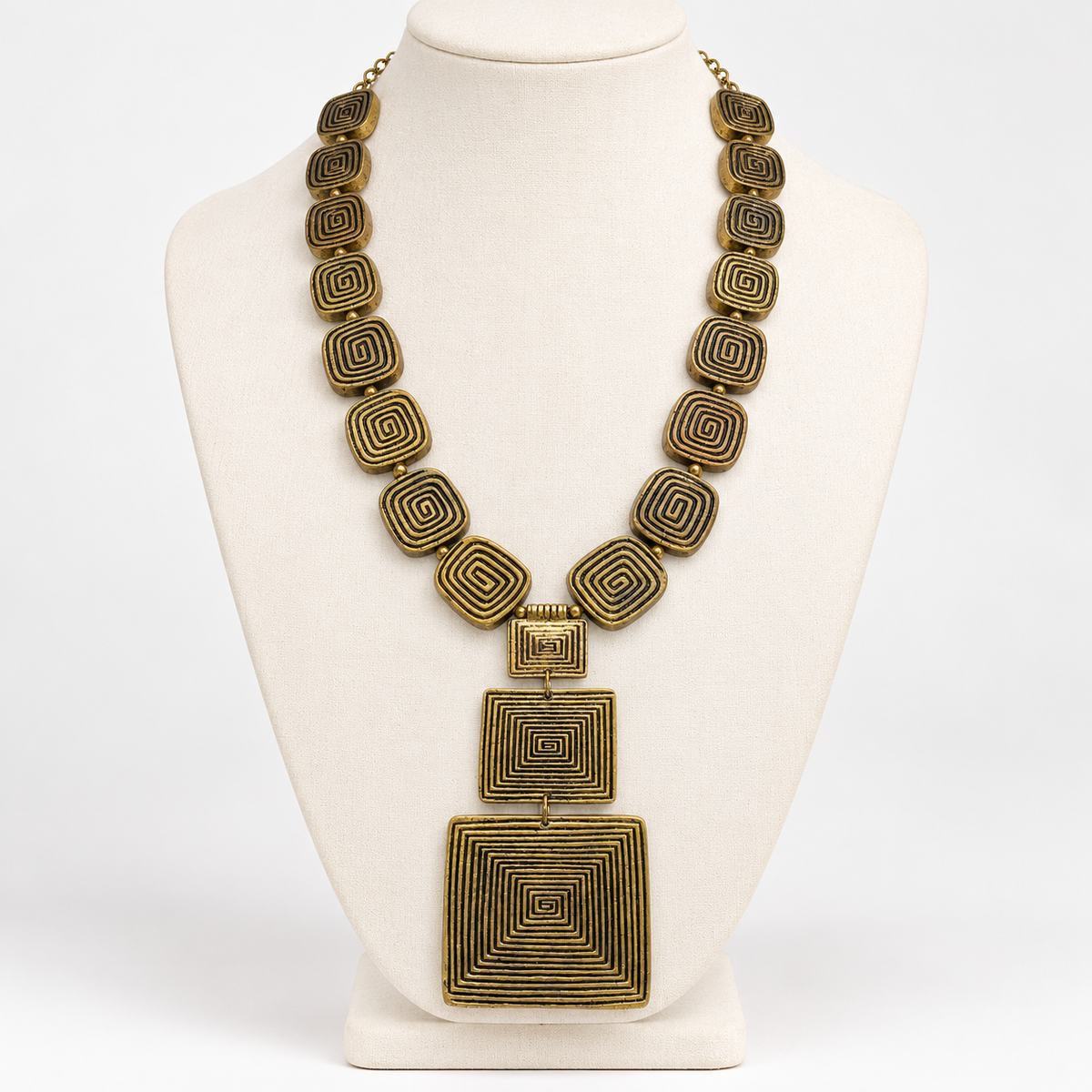 Geometric spiral metal statement necklace, bust display