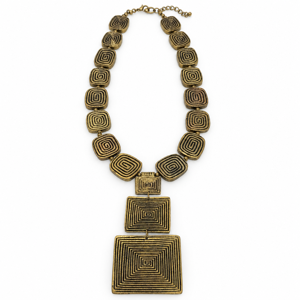 Geometric spiral metal statement necklace, flat view