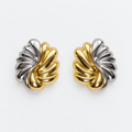 Pair of sculpted gold-tone and silver-tone leaf post-back stud earrings laid flat