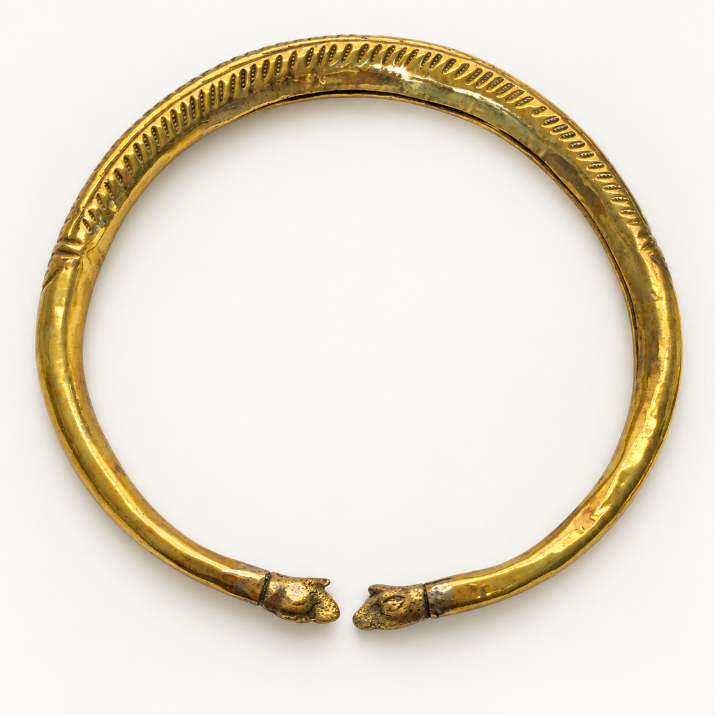 Vintage brass elephant collar necklace — flat view showing elephant terminals