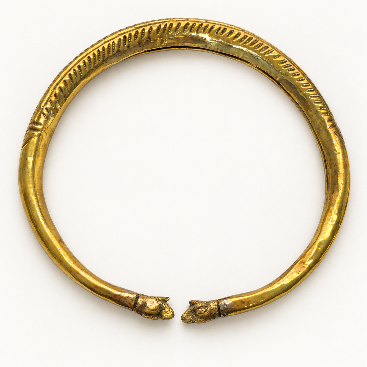 Vintage brass elephant collar necklace — flat view showing elephant terminals